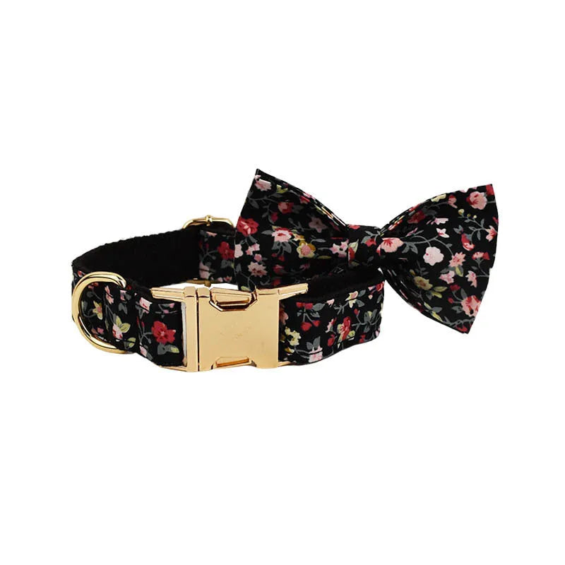 Four-piece dog accessory set showing a cloth collar, leash, vest, and removable bow with printed lettering.