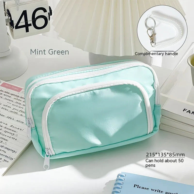 Solid colour double-layer pencil case for high-capacity exam stationery organisation.