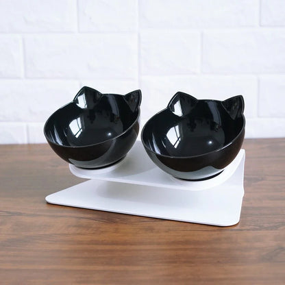 Tilted cat and dog bowls with raised stand, designed to reduce neck strain and protect cervical vertebrae.