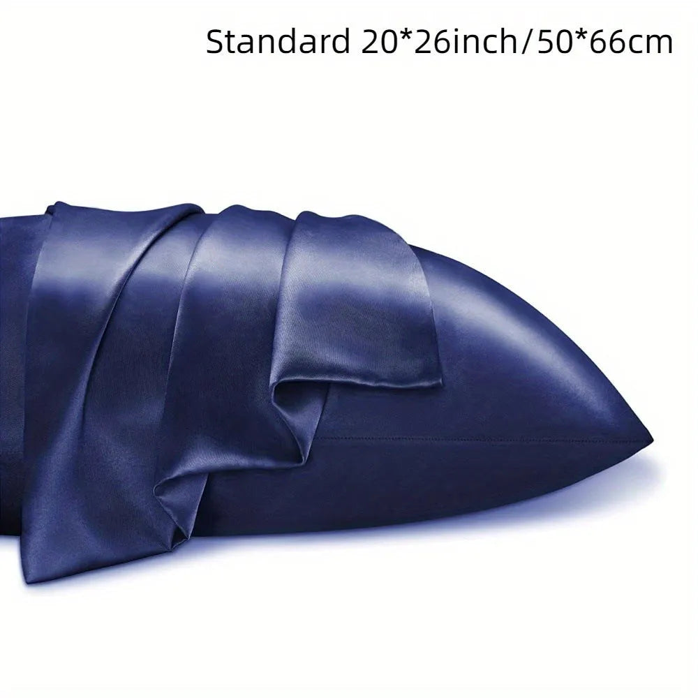 Pair of solid colour satin pillowcases showing smooth plain weave texture and reactive dye colour