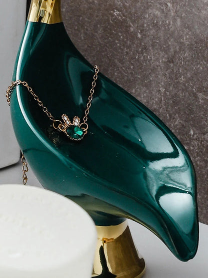 Ceramic swan soap rack in white and green, featuring a drainage cover