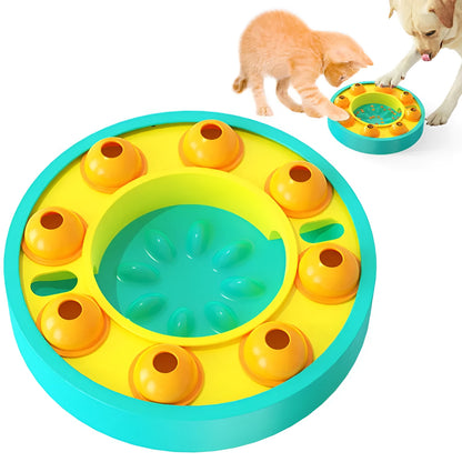 Square lake blue dog puzzle feeder with central column and rotating roulette top on a kitchen floor