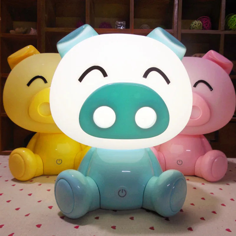 Cartoon pig small night lamp in ABS with 3W power, USB cable, power adapter, and blue, pink or yellow colour options.