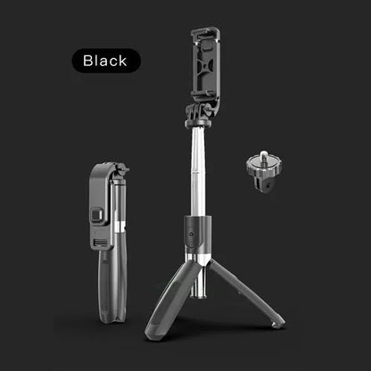 Black and white Bluetooth selfie stick extended with phone mounted, showing wireless remote and tripod base