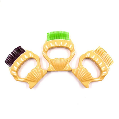 Green shell shaped pet grooming comb with bent wire bristles for removing loose hairs from dogs and cats