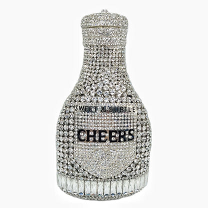 Gold hard-shell clutch bag shaped like a champagne bottle with a synthetic leather interior.