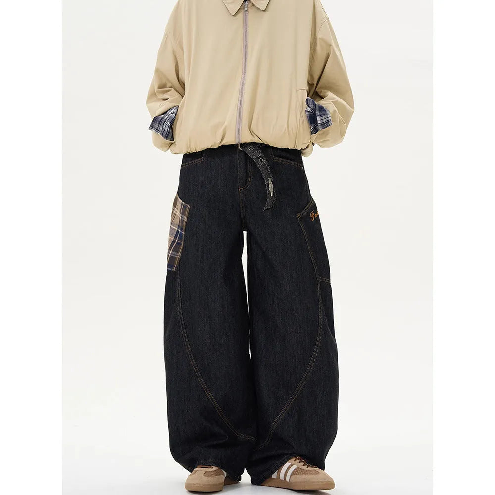 Loose straight-leg cotton trousers in a red plaid pattern, laid flat.