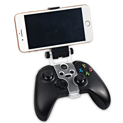 Black universal mobile phone holder bracket for car dashboard, office desk, or home use