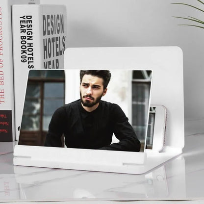 Black portable phone screen amplifier with 9 inch screen and integrated smartphone holder