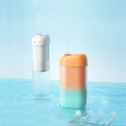Portable electric oral irrigator with multiple nozzles for deep cleaning