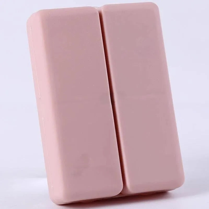 Blue foldable pill box with seven compartments and magnetic closure showing open and closed positions