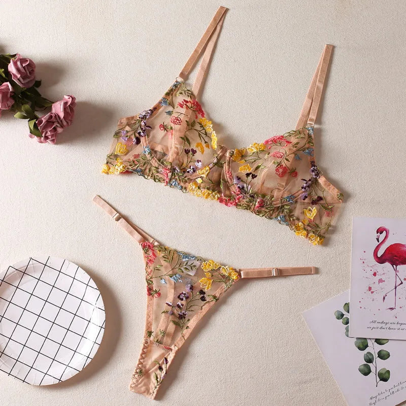 Floral mesh bra and T-back underwear set in skin colour on a mannequin