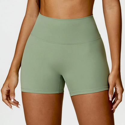 Women's high waist yoga shorts in nylon fabric with belly contracting design and hip lifting cut
