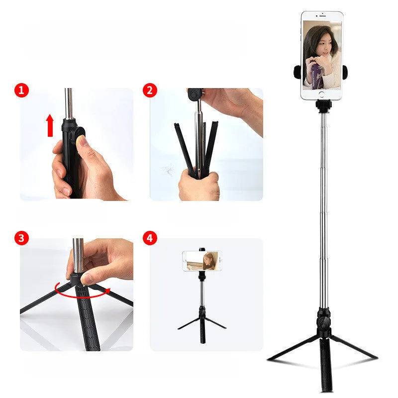 Black aluminium phone tripod stand with extended legs and a Bluetooth remote, holding an iPhone.