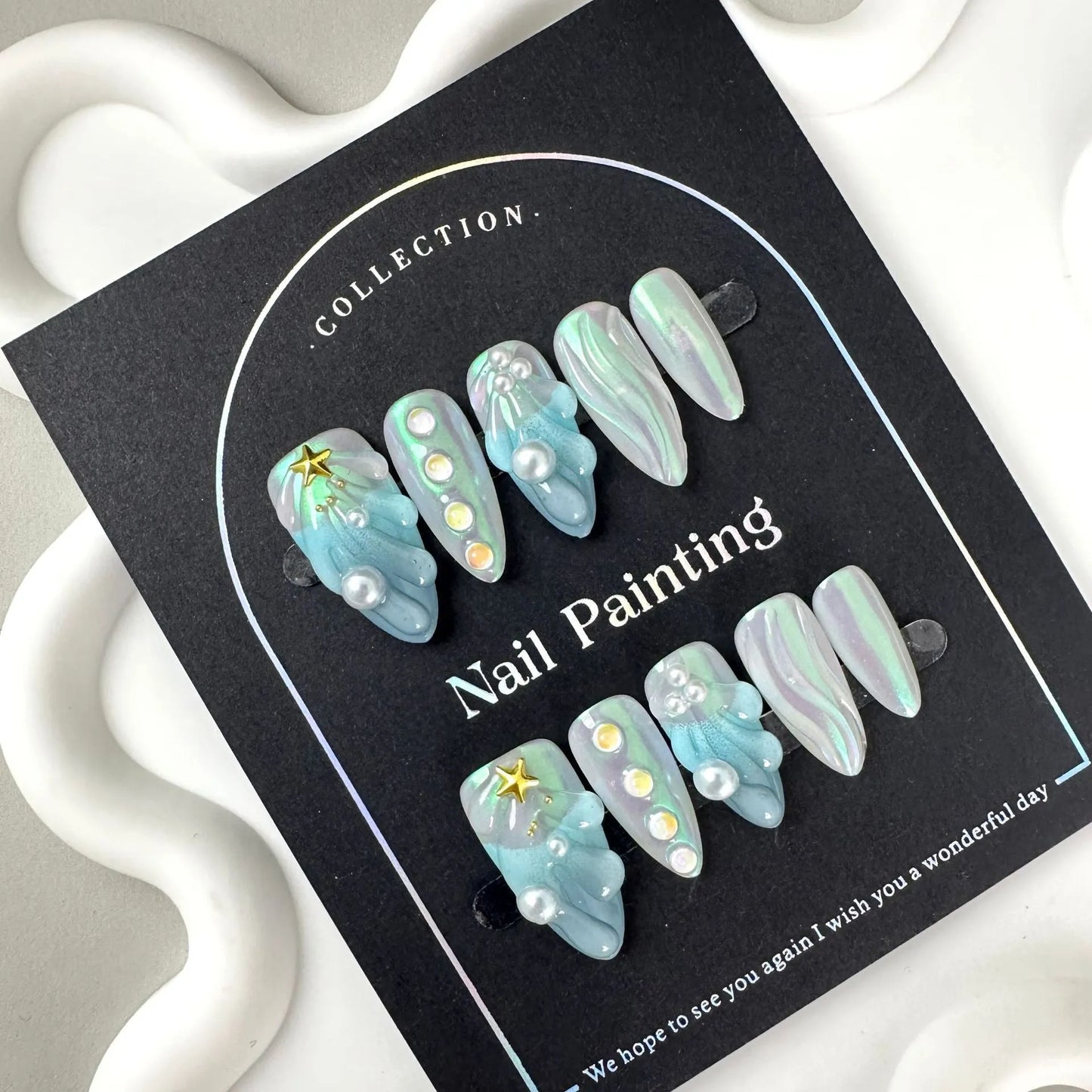 Blue shell design plastic nail tips in sizes XS, S, M, L from Hailang.