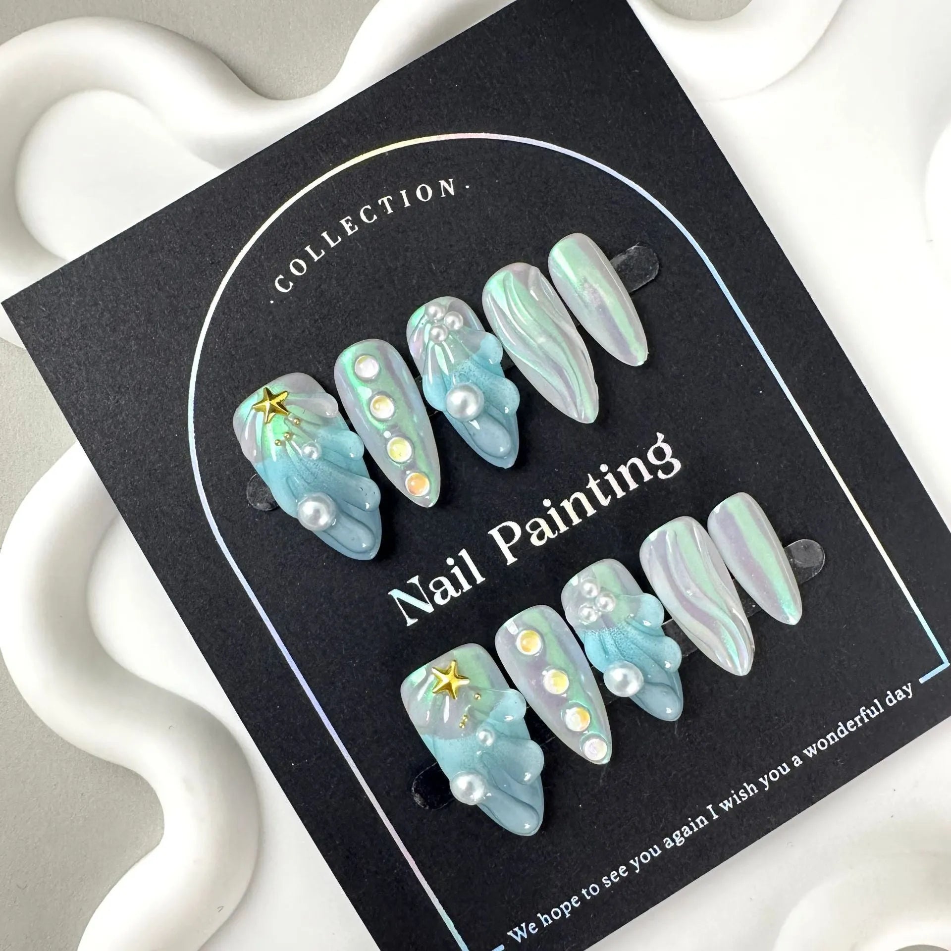 Blue shell design plastic nail tips in sizes XS, S, M, L from Hailang.