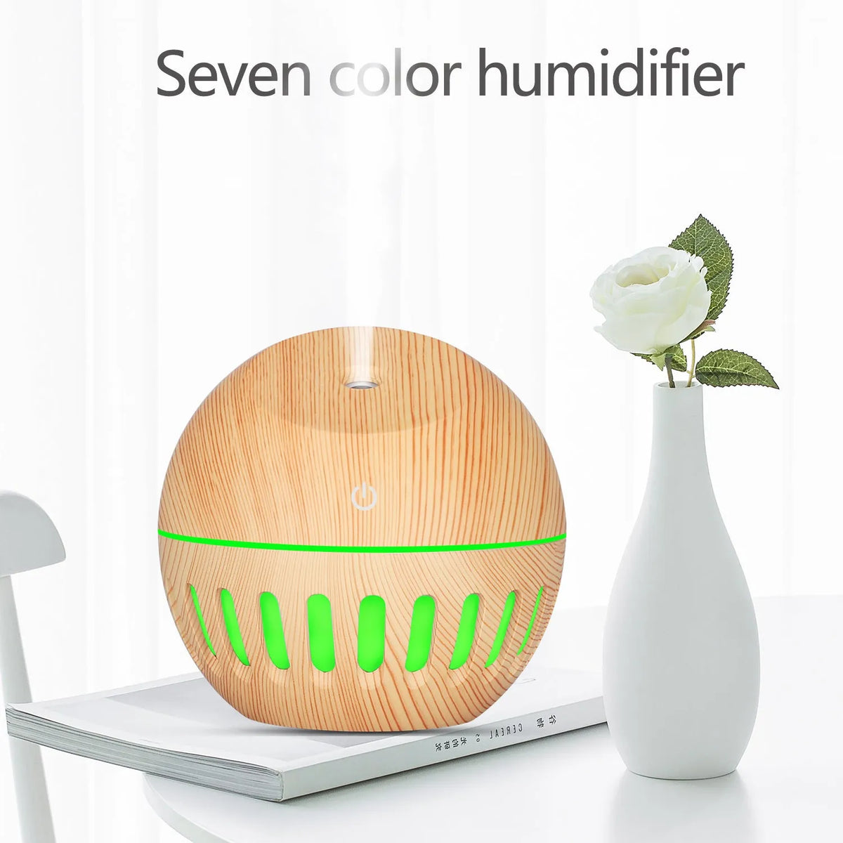 Portable USB humidifier in dark wood, light wood or white with 1 litre water tank and single fog outlet.