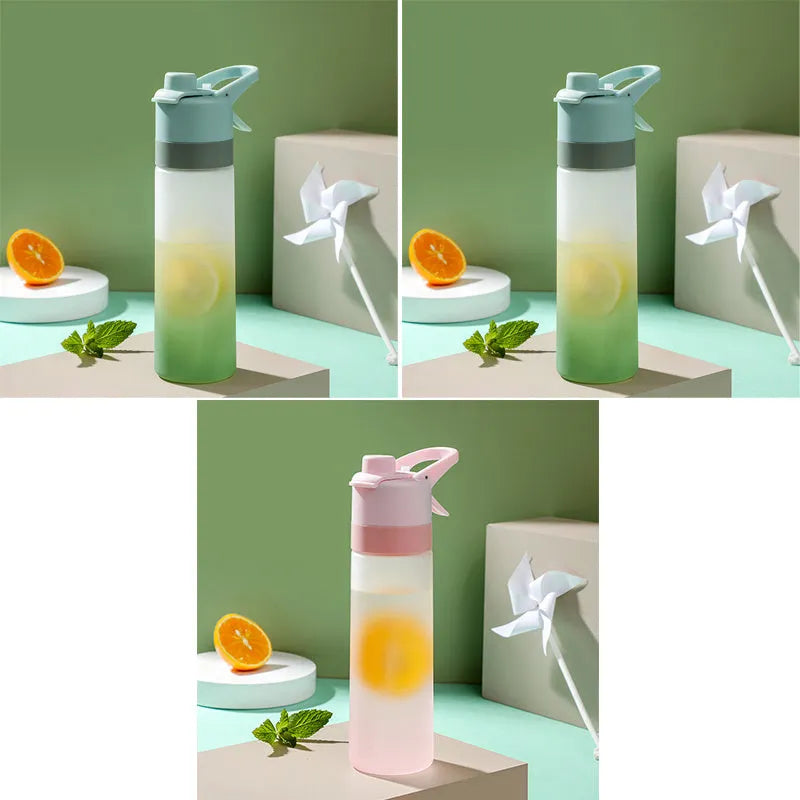 White spray water bottle with black leakproof lid and handle strap on a table