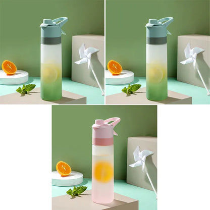White spray water bottle with black leakproof lid and handle strap on a table