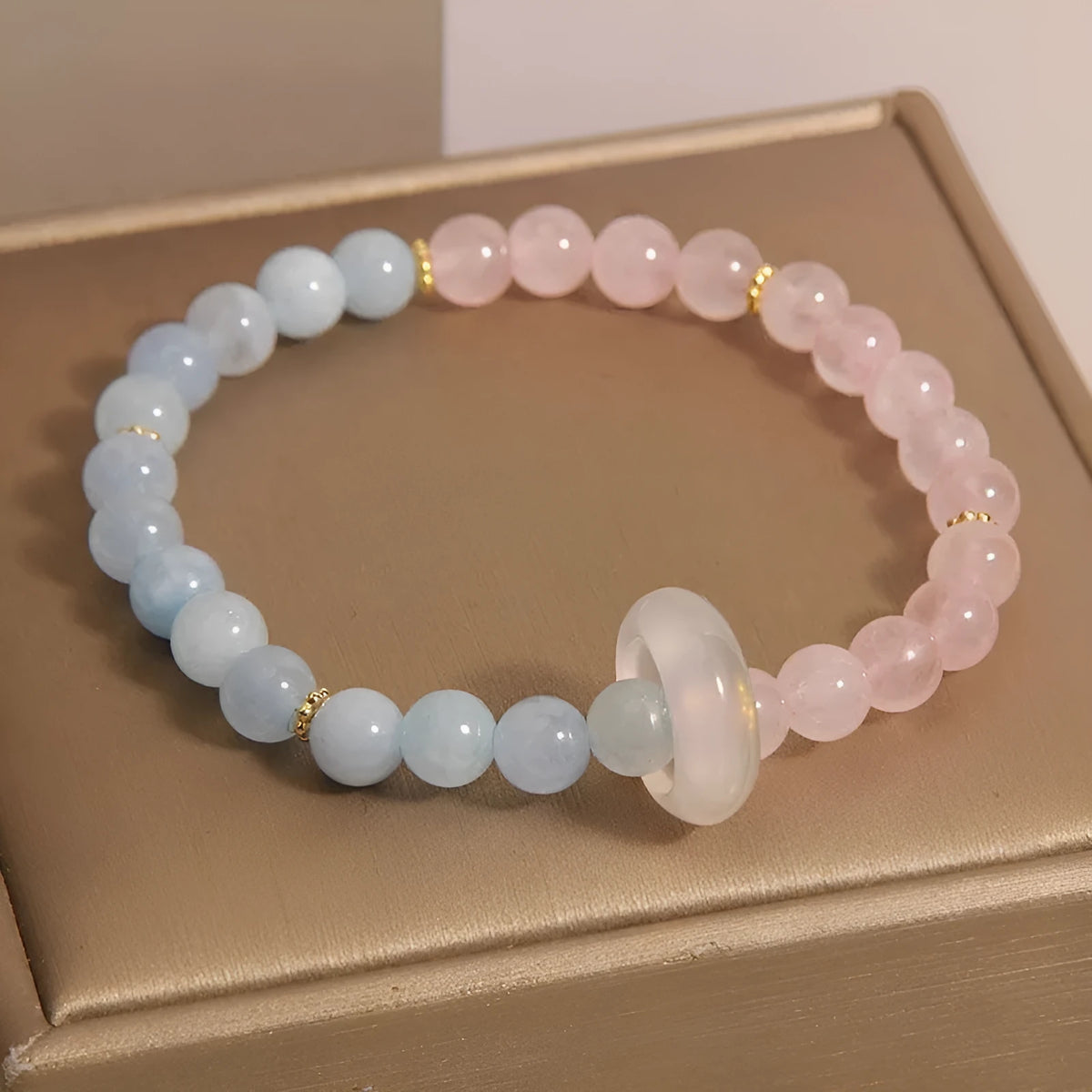 Aquamarine crystal bracelet with pink blue colour and geometric design elements