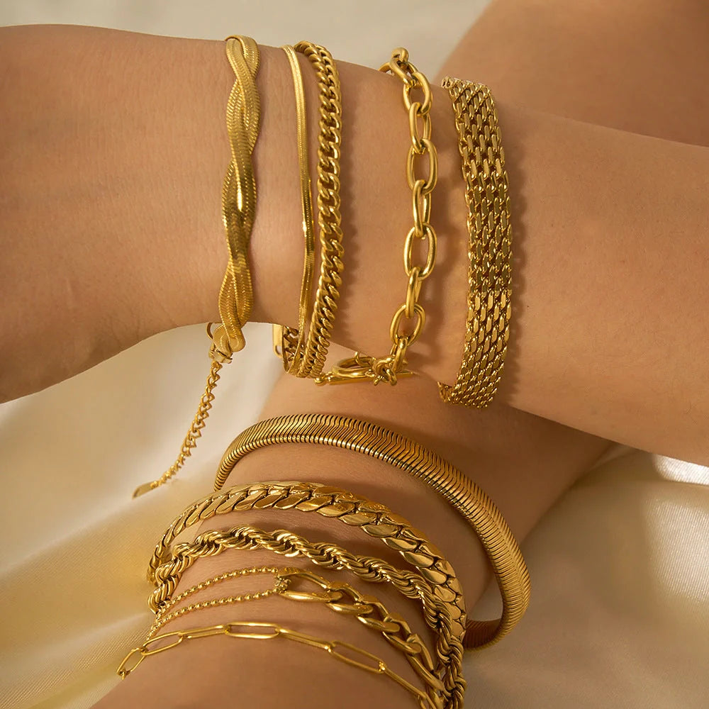 Elegant stainless steel bracelet with a sleek geometric design, gold-plated finish, and unisex style suitable for any occasion.