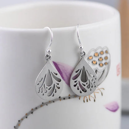 Women's retro hollow water drop silver earrings with small exquisite drop shape design