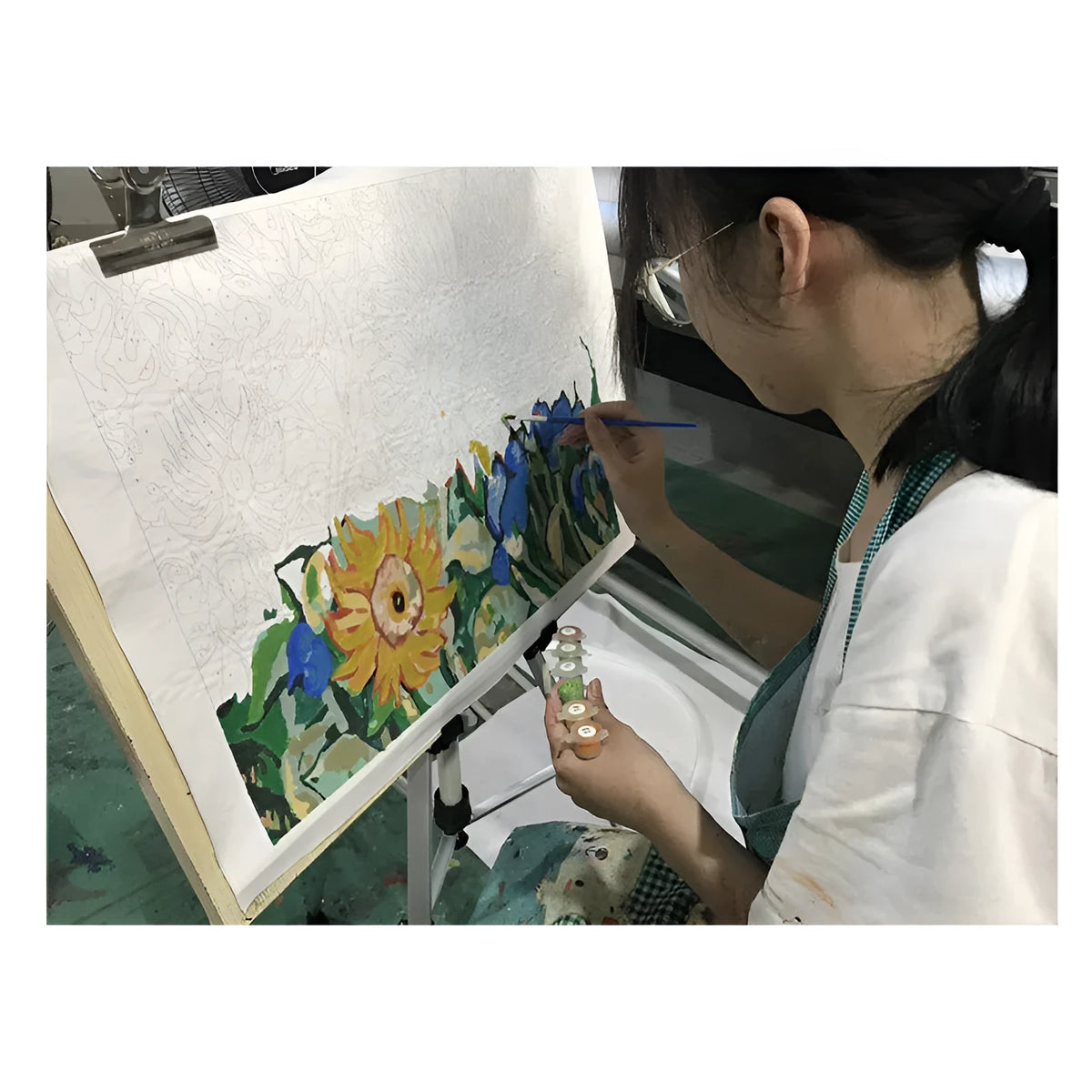 DIY digital painting kit showing 40x50cm canvas with body painting artwork, three brushes, and wall hooks