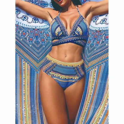 Blue red cross-back bandage bikini top and high-waisted brief from a women's three-piece swimsuit set.