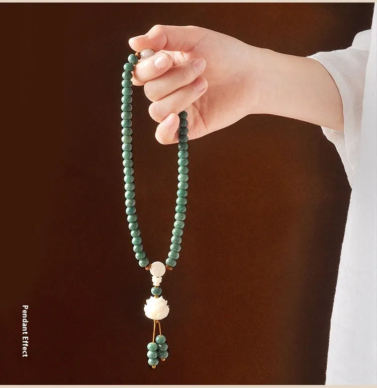 Unisex Bodhi seed bracelet with double ring safety buckle closure, featuring white jade and green sandalwood beads in a handcrafted Buddhist meditation accessory suitable for men and women seeking spiritual jewellery