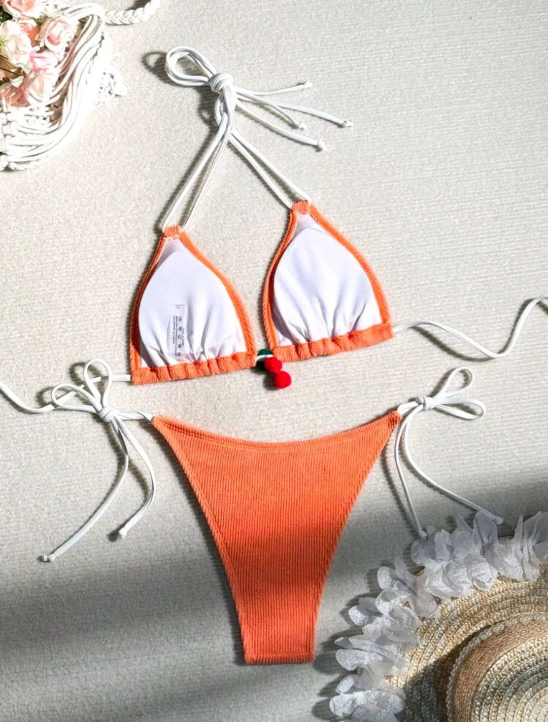 Women's sexy wind style bikini swimsuit in a solid colour, showing backless briefs design.
