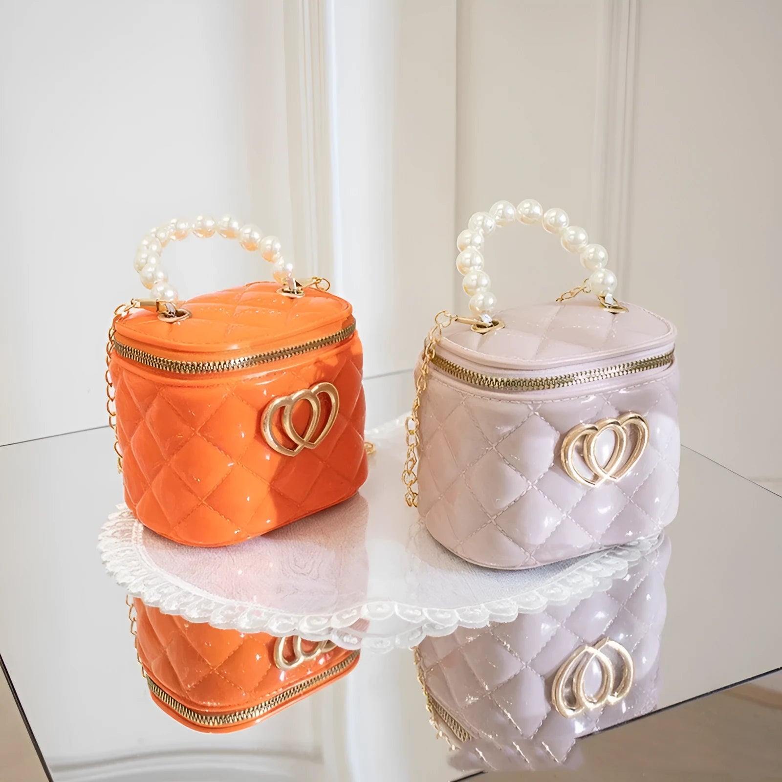 White PVC women's bucket bag with a heart-shaped pattern and shoulder strap.