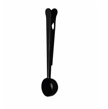 Silver stainless steel coffee scoop with integrated bag clip, measuring 17.5cm long