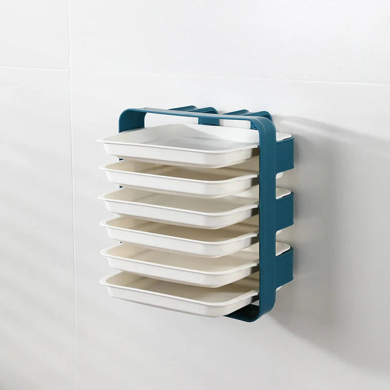 Wall-mounted kitchen shelf with stackable trays in navy blue, white, and coffee colour options