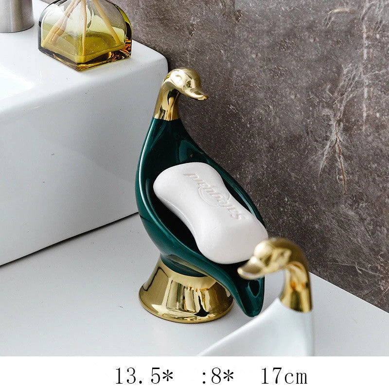 Ceramic swan soap rack in white and green, featuring a drainage cover