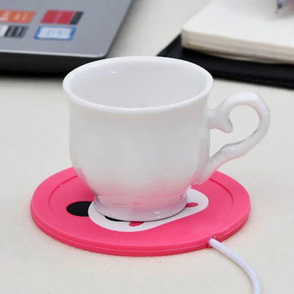 Cosy USB-powered heating pad with a soft rubber construction and a playful animal-inspired design, perfect for keeping mugs and cups warm