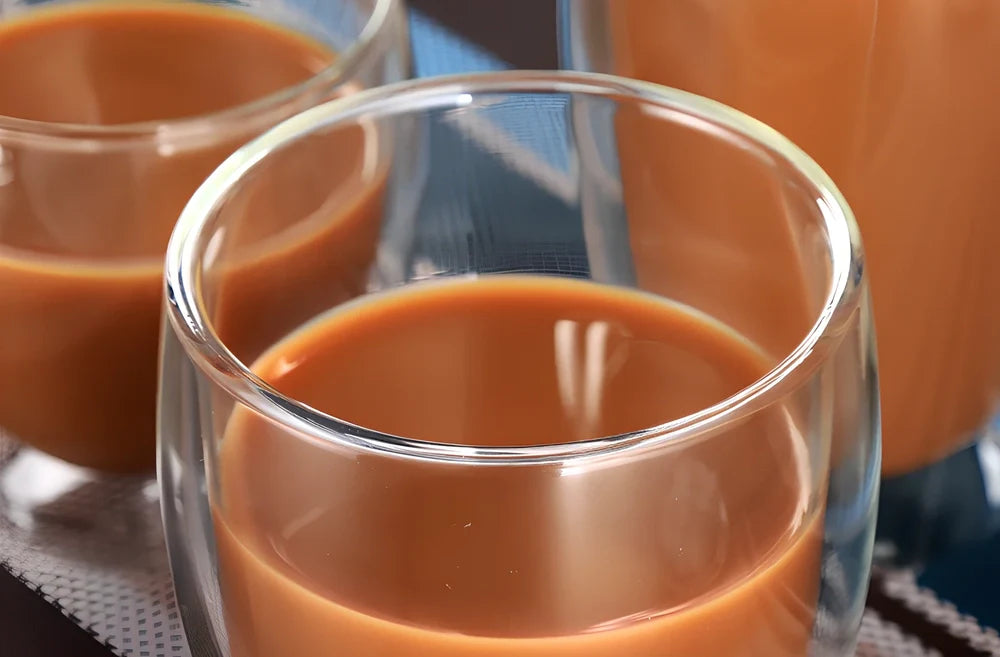 Chinese style double-layer glass coffee cup showing heat-resistant construction and traditional design elements
