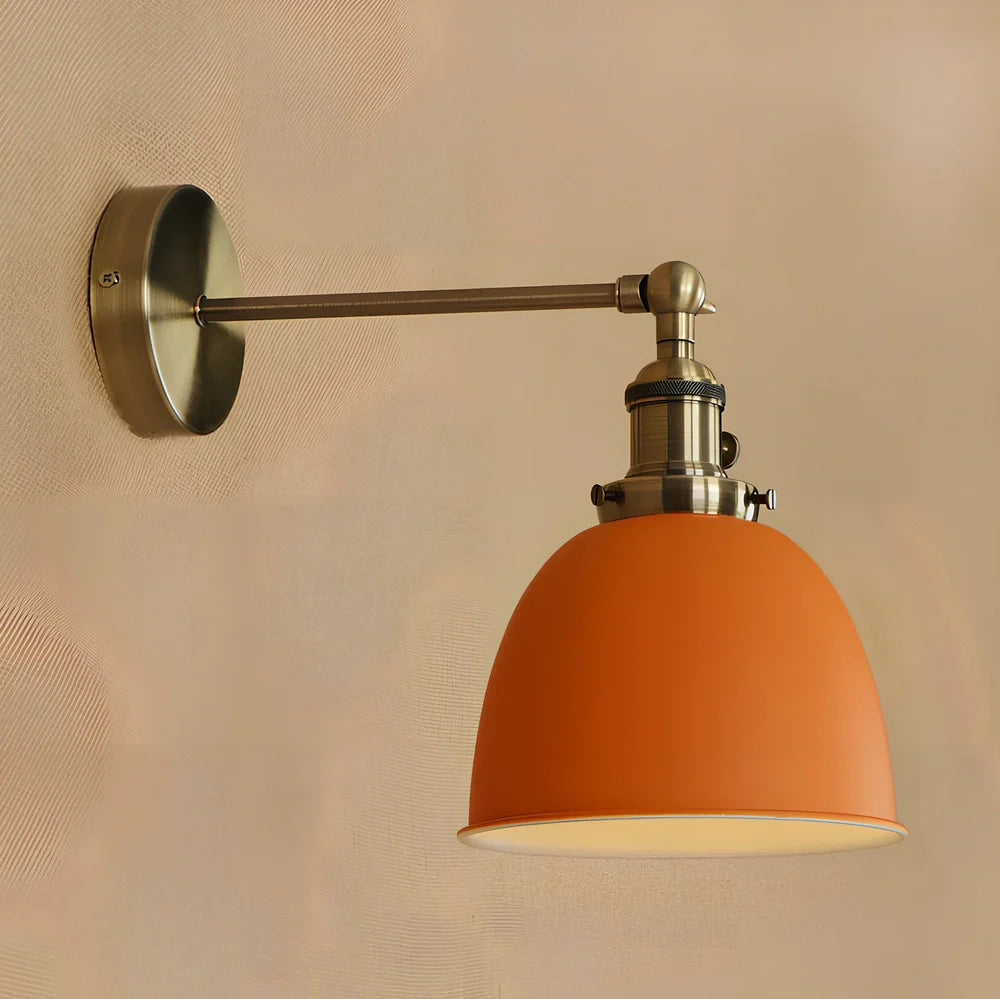 Bedroom wall light with 15cm wide iron shade in pink colour, mounted 20cm projection for soft illumination