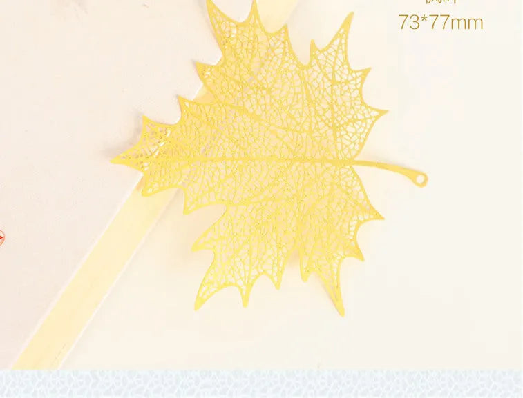Brass metal bookmark with hollow plating leaf design and rose gold tassel decoration