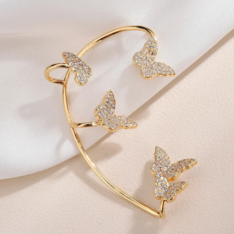 Elegant gold-plated butterfly ear cuffs with sparkling zircon accents, perfect for women's fashion and accessorizing