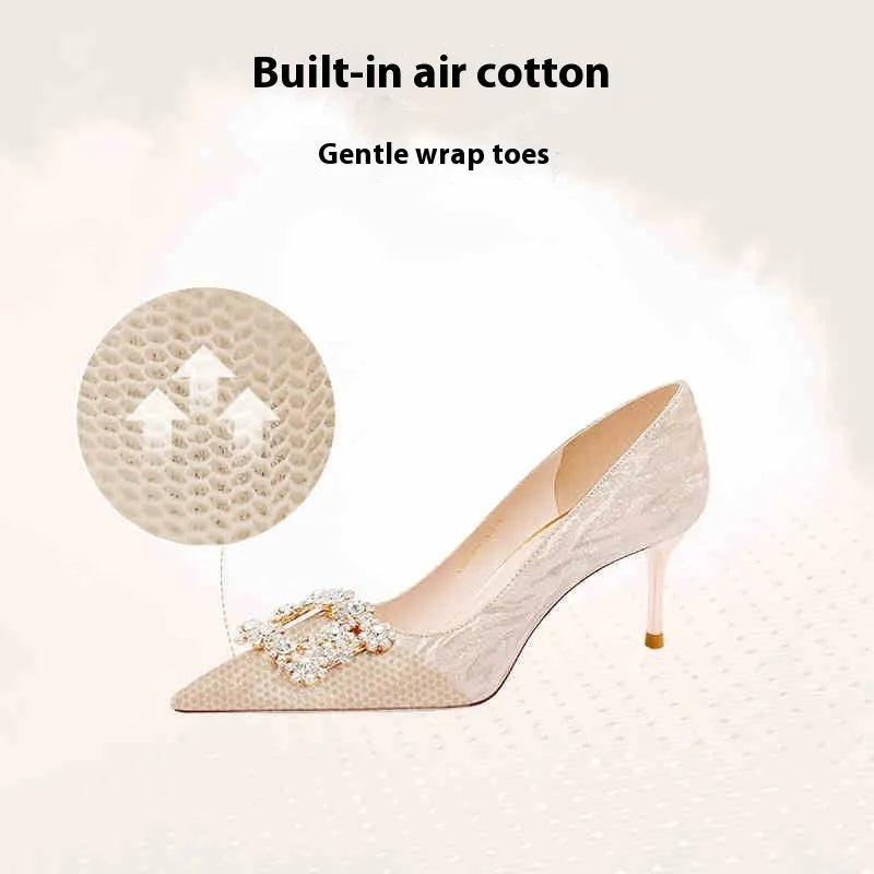 Champagne gold pointed-toe high heel pumps with stiletto heel and rhinestone decoration on the upper.