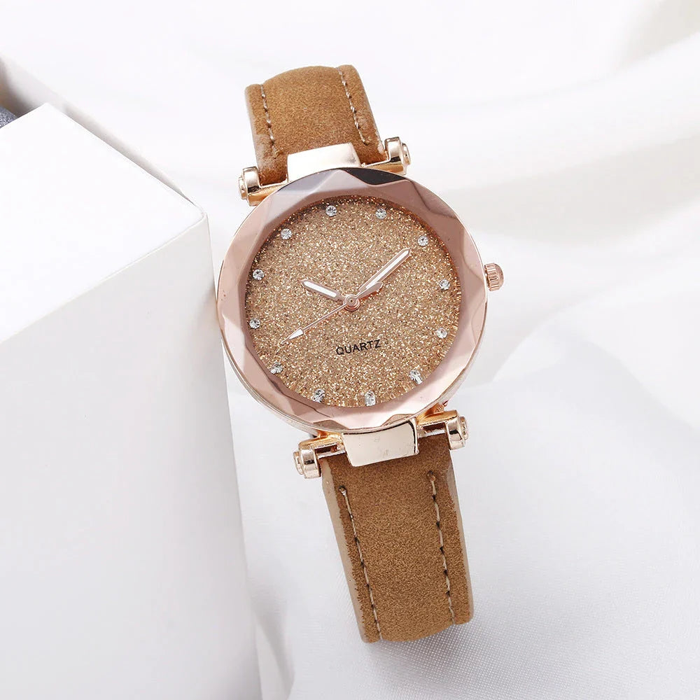 Elegant women's wrist watch with a captivating starry sky dial and leather strap, suitable for any occasion.