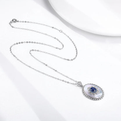 Elegant sapphire and diamond pendant necklace in 925 sterling silver, featuring a sparkling gemstone design and adjustable chain.