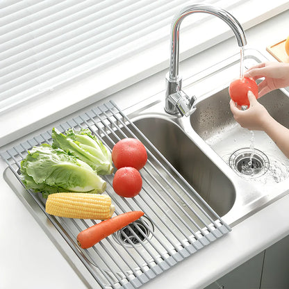 Stainless steel sink drain rack with rolling curtain design folded to show compact 5cm storage thickness