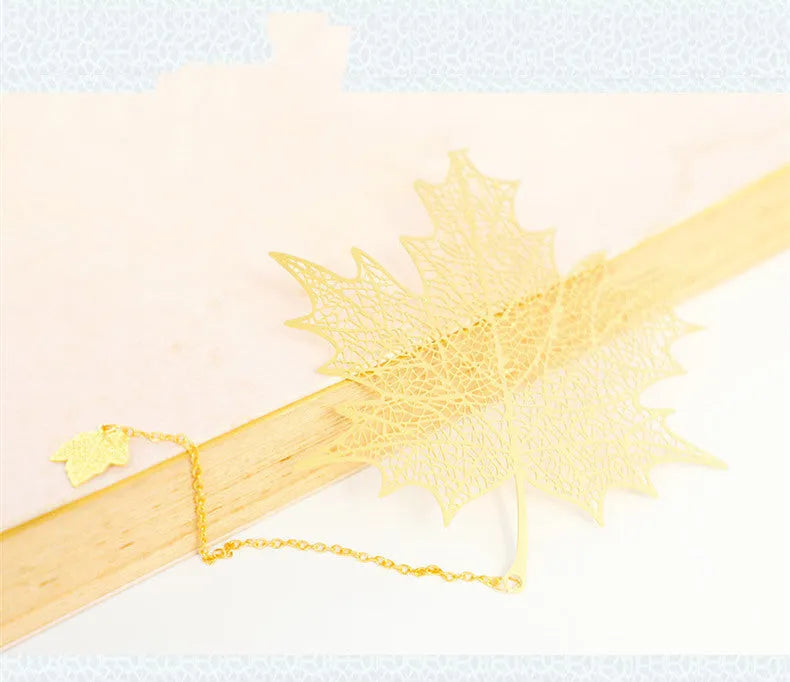 Brass metal bookmark with hollow plating leaf design and rose gold tassel decoration