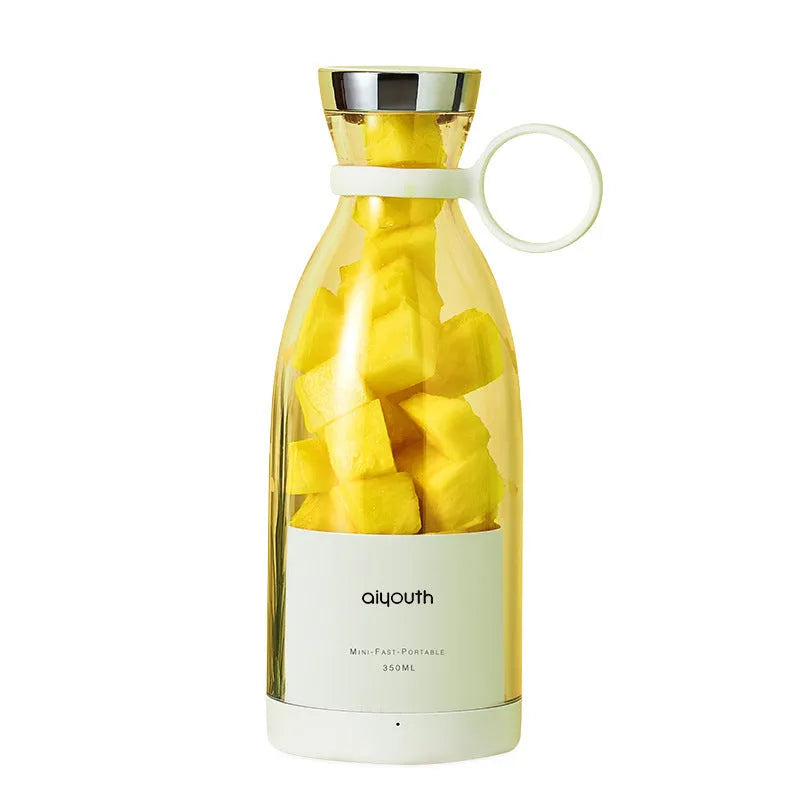 Handheld portable mini juicer in pink with USB charging cable and measuring 18cm tall