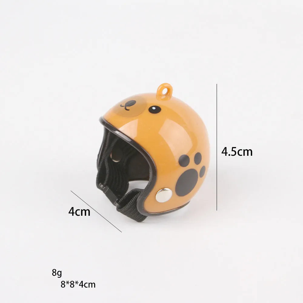 Small hard plastic helmet with elastic straps and sponge lining, designed for a chicken or bird to wear.