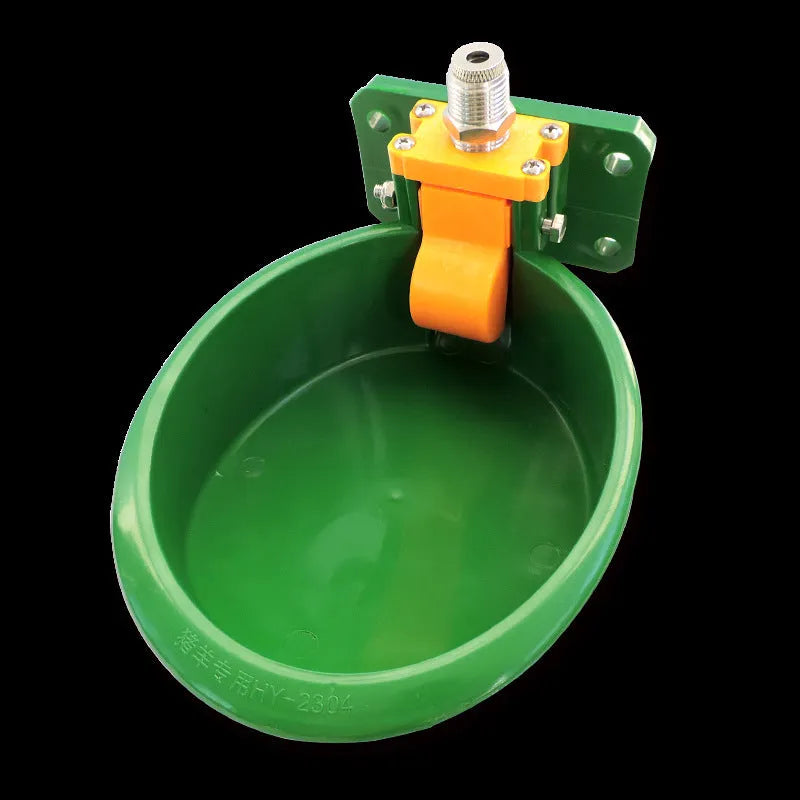 Green plastic automatic water drinking bowl for sheep and pigs on farm