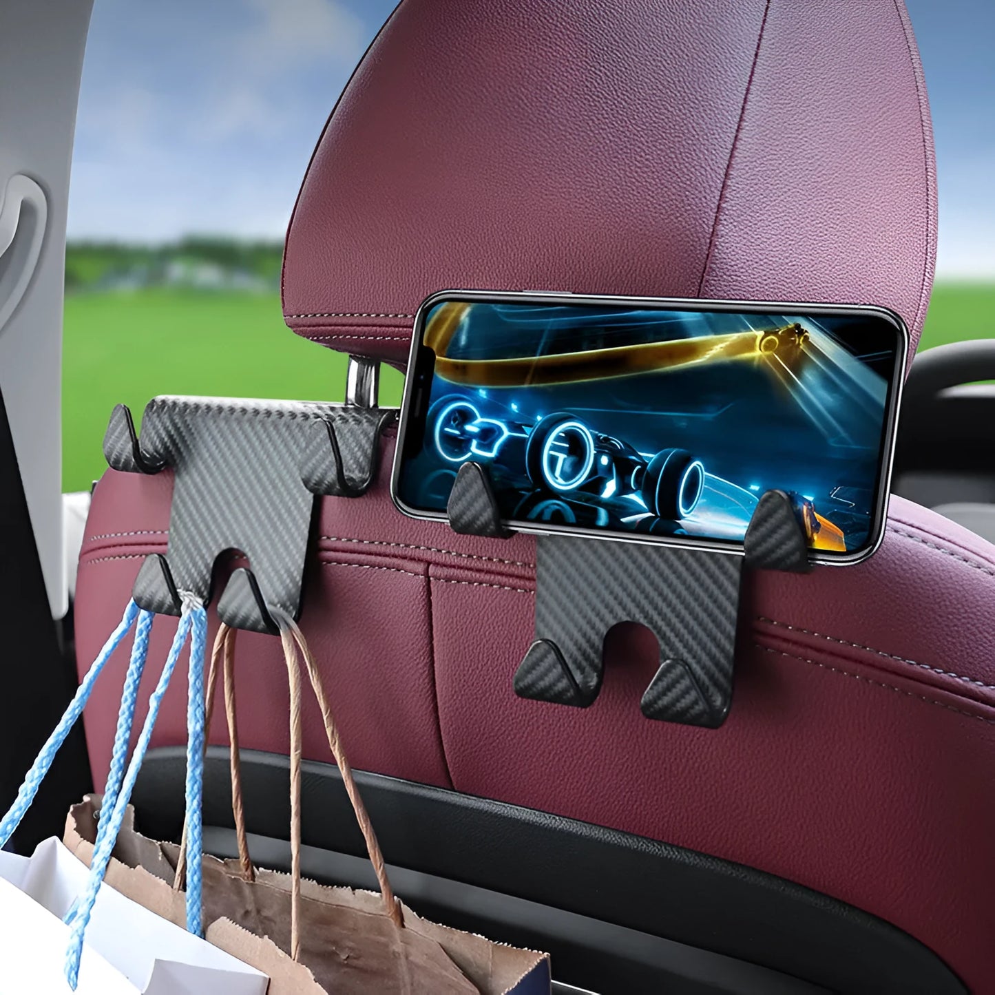 Black ABS plastic car hook and mobile phone holder bracket for rear seat mounting.