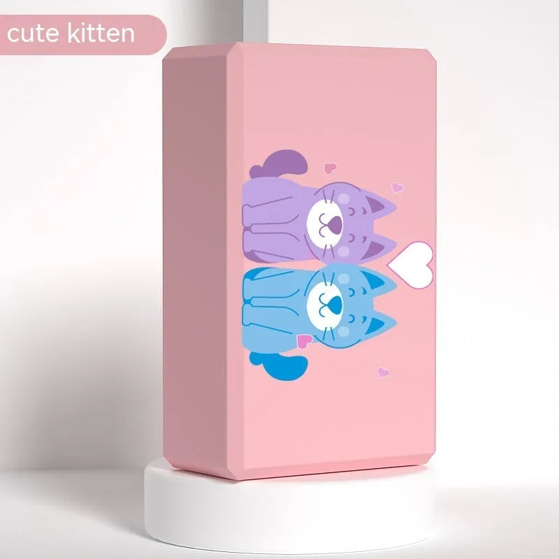 High-density EVA foam yoga block in violet colour, shown next to a pink block with a cartoon bunny print.