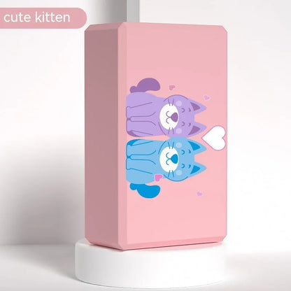 High-density EVA foam yoga block in violet colour, shown next to a pink block with a cartoon bunny print.
